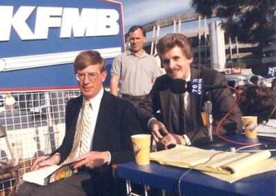 On-air with columnist, George Will, at San Diego Stadium.