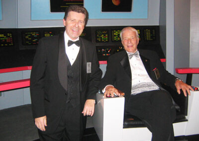 "WARP FIVE!!!" With famed "Original 7" astronaut Scott Carpenter on the "flight deck" of the Enterprise. San Diego Air & Space Museum's "Star Trek: The Exhibition" (prior to emceeing annual Hall of Fame Induction Gala honoring Mr. Carpenter), October 25, 2008.