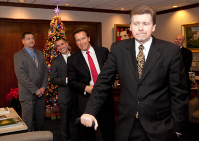 Waiting to interview the Governator in Sacramento (his only longform radio interview during his last days in office), December 2010. Deep in thought about Q&A, Arnold and staffers slipped in behind ...unknown to Larson... where they posed for a few moments before ML figured it out (the surprise photo was the tip off). Despite many differences on issues, the friendship endures.