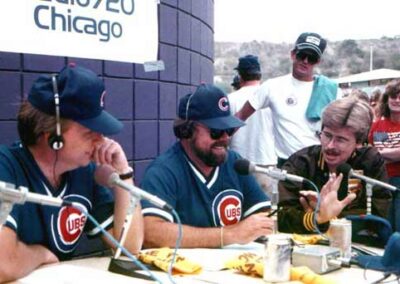 The start of a sixteen-year friendship with the legendary Bob Collins of WGN, Chicago. His newsman, Tom Peterson is on the left. Seen during the Cubs-Padres playoffs in 1984 on a WGN Broadcast. Collins died tragically in a private plane crash in early 2000. (Ah, those were the "big hair days." Though Tom and Bob were "follically challenged" . . . as evidenced by their HATS!)