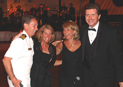 USS Ronald Reagan XO Capt. Billy Hart, wife Maureen and the Larsons.... working VERY hard at the Santa Barbara Navy League Gala, August 20, 2005.