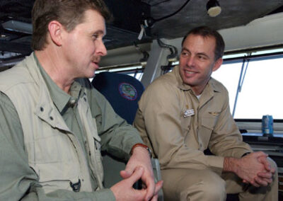 With Capt. Terry Kraft, Commanding Officer of the USS Ronald Reagan, on the ship's bridge in the Arabian Gulf. March 2006.